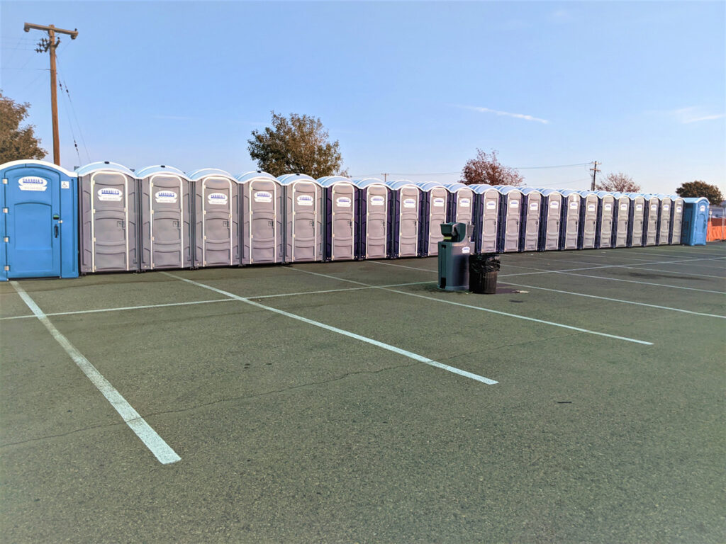 A line of portable restrooms at an El Paso event.