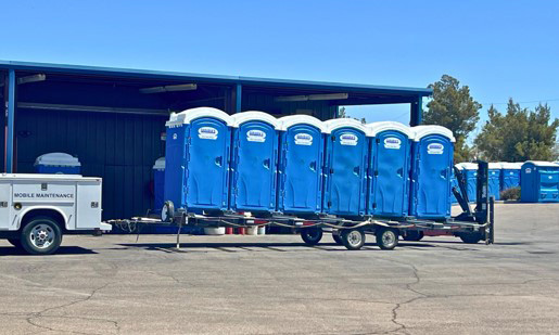 A trailer full of blue Sarabia’s portable bathroom rentals in El Paso.