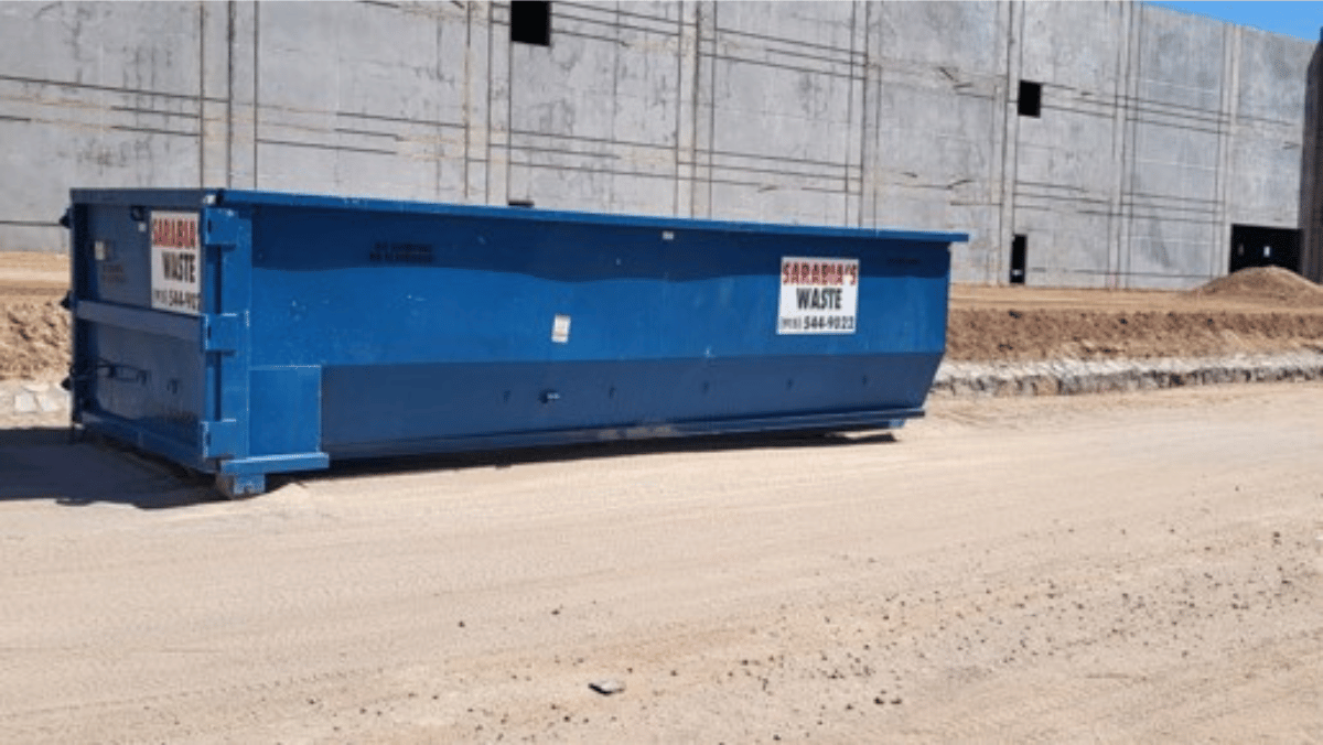 A roll-off dumpster in a construction zone