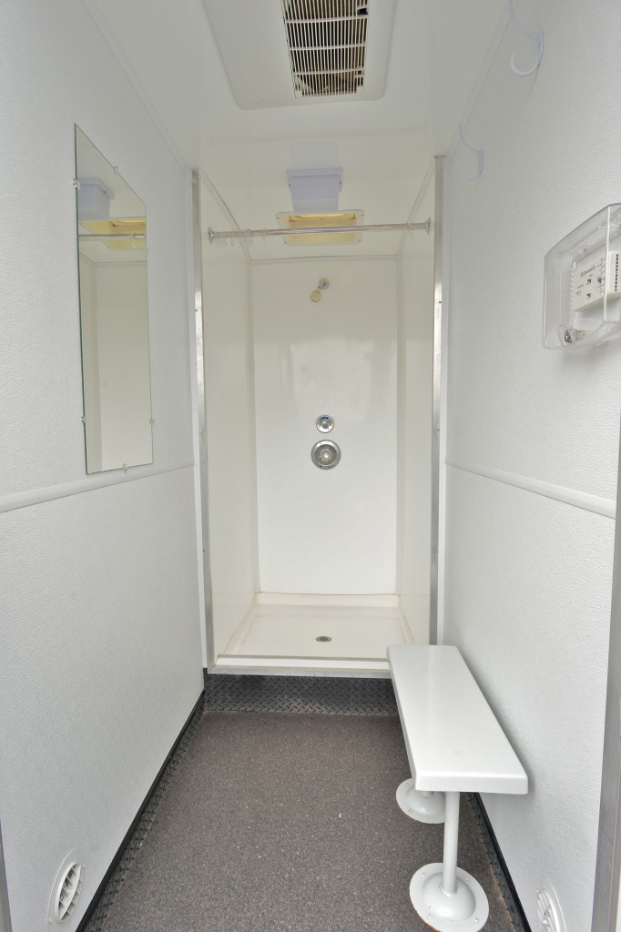 Inside the Shower Trailer is 21 ft long, 13 ft wide (with stairs down), and 13 ft high. It is equipped with 6 private individual shower accommodations.